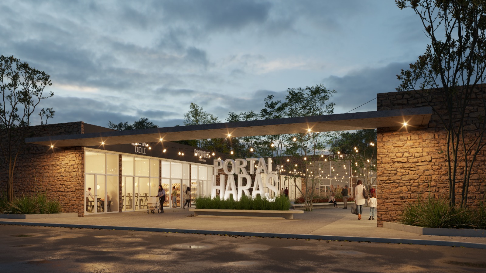 Entrada principal de Portal Haras con iluminación nocturna
