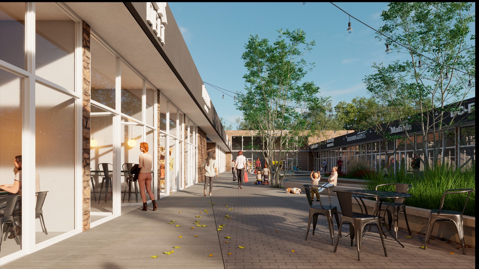 Paseo comercial interno con locales y terrazas